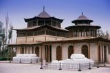 The Kings of Hami were hereditary Uighur rulers who paid tribute to China. The last king of Hami, Maqsud Shah died in the mid-1930s. Nine generations of kings of Hami are buried here.<br/><br/>

The ancient oasis settlement of Hami, also known in Uighur as Kumul, sits in a fault depression about 200m below sea level and, like nearby Turpan, experiences extremes of temperature ranging from a scalding 45C in summer to a freezing -30C in winter.<br/><br/>

Silk Road caravans stopped in Hami for its fresh springs and water runoff brought by karez underground canals from the distant Karlik Tagh, and for its fabled fresh fruit – Hami melons are famous across China today. More importantly still, they stopped here because there simply was nowhere else to go. Hami still remains the only significant oasis in the Gashun Gobi, an essential stop on the long and difficult desert stages between Anxi and Turpan.