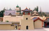 The Kings of Hami were hereditary Uighur rulers who paid tribute to China. The last king of Hami, Maqsud Shah died in the mid-1930s. Nine generations of kings of Hami are buried here.<br/><br/>

The ancient oasis settlement of Hami, also known in Uighur as Kumul, sits in a fault depression about 200m below sea level and, like nearby Turpan, experiences extremes of temperature ranging from a scalding 45C in summer to a freezing -30C in winter.<br/><br/>

Silk Road caravans stopped in Hami for its fresh springs and water runoff brought by karez underground canals from the distant Karlik Tagh, and for its fabled fresh fruit – Hami melons are famous across China today. More importantly still, they stopped here because there simply was nowhere else to go. Hami still remains the only significant oasis in the Gashun Gobi, an essential stop on the long and difficult desert stages between Anxi and Turpan.