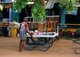 India: Holi powder vendor in ancient Hampi, Karnataka State